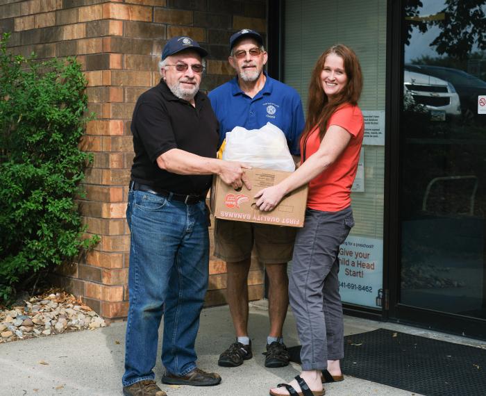 Volunteers deliver food from pantry to those unable to drive.